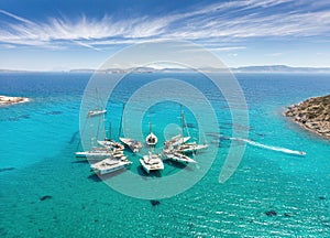 Sailing boats in star formation in Greece Polyaigos, Cyclades, sailing destinations