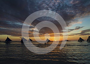 Sailing boats at sunset boracay tropical island philippines