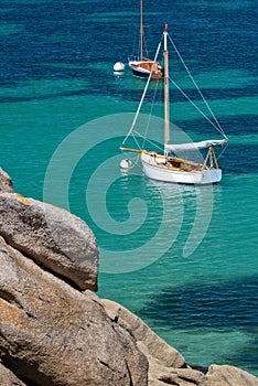 Sailing Boats and transparent water on Coz-Pors beach in Tregastel CÃÂ´tes d`Armor, Brittany, France