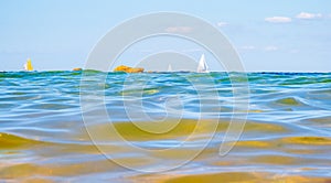 Sailing boats and waves seen by a swimmer at sea level, photography taken in VendÃ©e