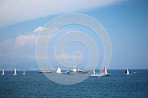 Sailing boats and yachts on blue sea water