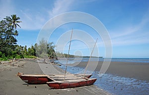 Sailing canoe at beach Papua New Guinea