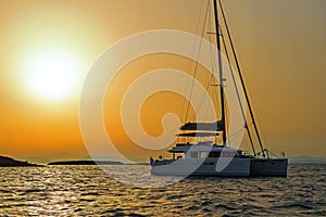 Sailing Catamaran at the sunset