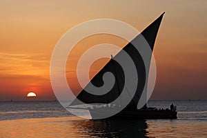 Sailing in a dhow during sunset in a tropical Island