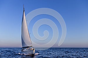 Sailing in the dusk in the Aegean sea, Greece photo