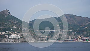 Sailing on Mediterranean Sea near Amalfi coast in Campania, province of saltern, Italy. Looking at hillside town houses