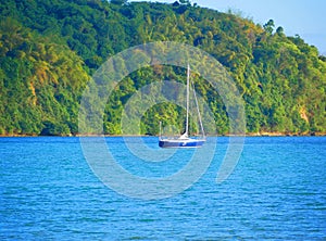 Sailing n the Caribbean sea ocean on yacht boat with mountains in sight - Jamaica