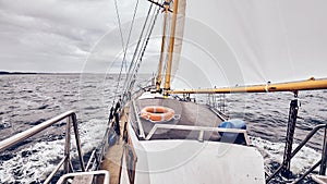 Sailing old schooner on a stormy weather