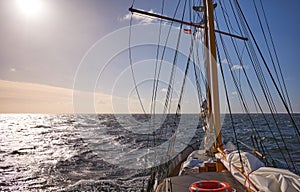 Sailing old schooner at sunset, travel and adventure concept