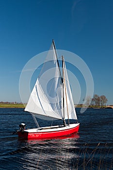 Sailing in a red small boat