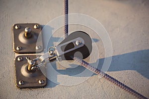 The sailing rope dragged by small block photo
