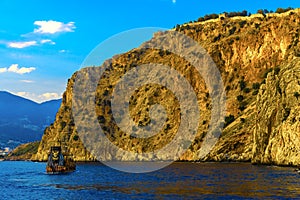 Sailing ship on background of rock