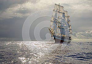 Sailing ship on the background of stormy sky. Sailing. Luxury yacht.