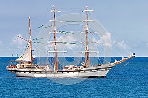 Sailing ship on a calm blue sea