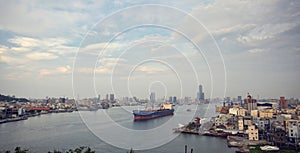 A sailing ship and city view at Kaohsiung harbor (Gao Xiong, Taiwan)