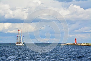 The sailing ship enters the port, beautiful landscape