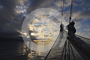 Sailing ship in front of sunset