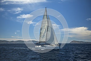 Sailing ship luxury yacht with white sails in the Aegean Sea. Sport.