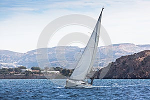 Sailing ship luxury yacht with white sails in the Sea. Sport.