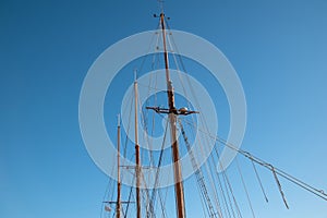 Sailing ship mast against the blue sky