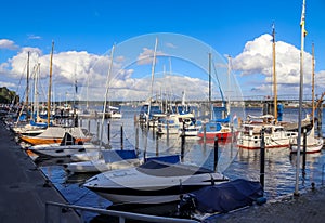 Sailing ship mast against the blue sky on some sailing boats with rigging details