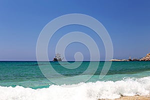 Sailing ship at sea under clear sky