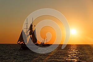 Sailing ship silhouette in sunset on the sea