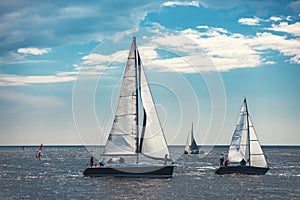 Sailing ship yacht with white sails in the sea