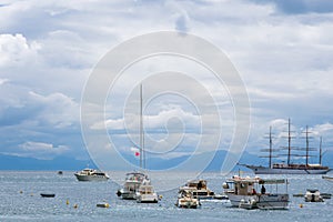 Sailing ship, yachts, fishing boats, and boats in Amalfi Harbor Marina Coppola, Amalfi Port, province of Salerno, the region of Ca