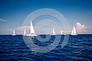 Sailing ship yachts with white sails