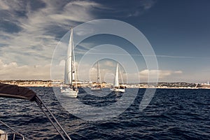 Sailing ship yachts with white sails