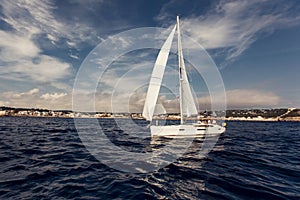 Sailing ship yachts with white sails