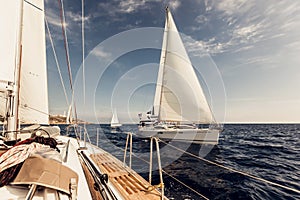 Sailing ship yachts with white sails photo