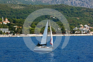 Sailing ship yachts with white sails on the Sea. Montenegro, Kotor Bay.