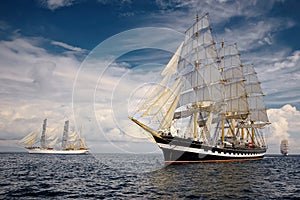 Sailing ships on the background of a very beautiful sky. Sailing. Luxury yacht.