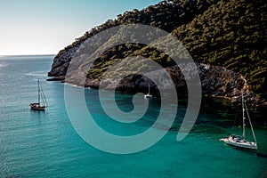 Sailing ships in the bay of Cala Llonga