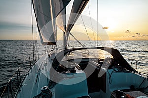 Sailing into the sunset on a sailing yacht