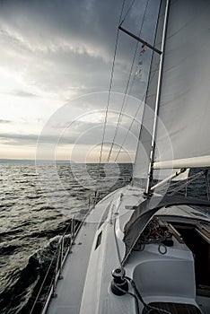 Sailing into the sunset on a sailing yacht