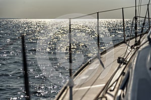 Sailing into the sunset on a sailing yacht