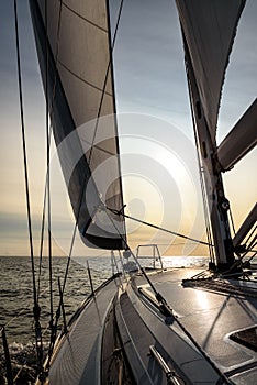 Sailing into the sunset on a sailing yacht