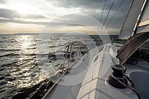 Sailing into the sunset on a sailing yacht