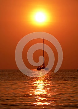 Sailing towards hazy sunset, Andaman Sea, Asia photo