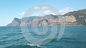 Sailing towards Malcesine in Garda lake in Italy 4K 2