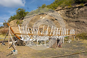 A sailing vessel being crafted in the caribbean