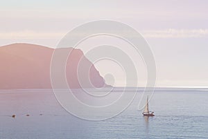 Sailing voyage cruise travel concept of sailboats sail on water in sea with mountain on background with skyline and copy space in