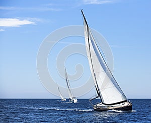 Sailing in the wind through the waves at the Aegean Sea in Greece