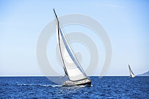 Sailing in the wind through the waves at the Aegean Sea in Greece.