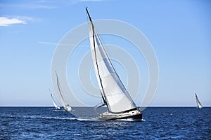 Sailing in the wind through the waves at the Aegean Sea in Greece.