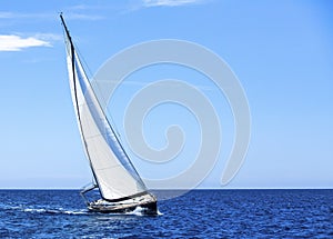 Sailing in the wind through the waves at the Aegean Sea.