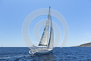 Sailing in the wind through the waves at the Aegean Sea.